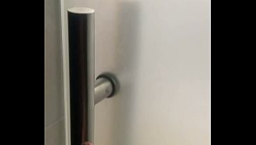 2 boys having fun at the pool public toilets’ urinal